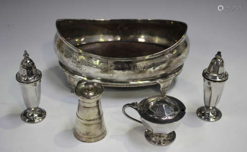 A George III silver oval boat shaped cruet stand with engrav...