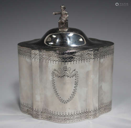 A George III silver tea caddy of oval serpentine form, the d...