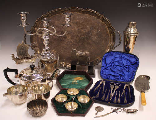 A collection of plated items, including a set of four salts ...