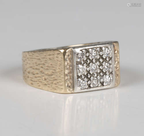 A 9ct gold and diamond nine stone square panel shaped ring w...