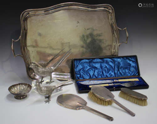 A George V silver three-piece dressing table set with engine...