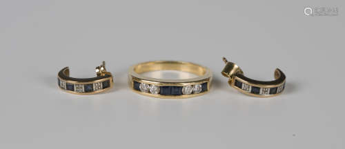 An 18ct gold, sapphire and diamond ring, channel set with tw...