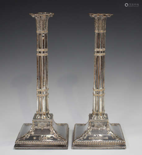 A pair of George III Sheffield plate candlesticks, each with...