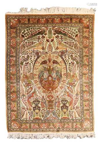 A silk Qum rug,