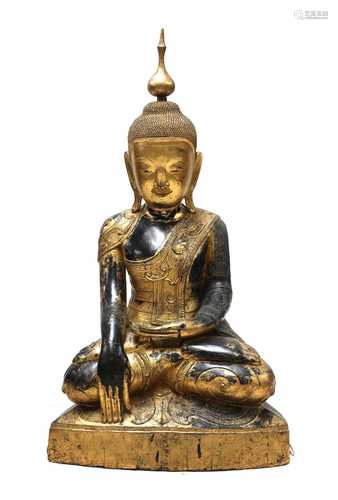 A large South-East Asian wooden and lacquered Shakyamuni bud...