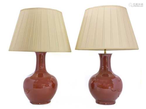 A pair of Chinese-style porcelain sang-de-boeuf table lamps,