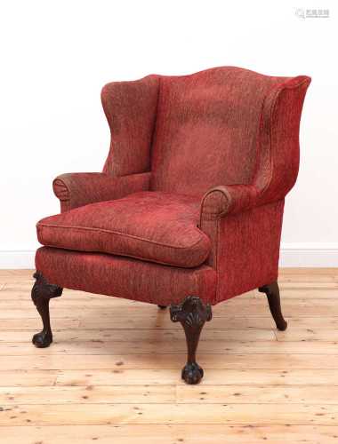 A George III-style mahogany-framed wingback armchair,