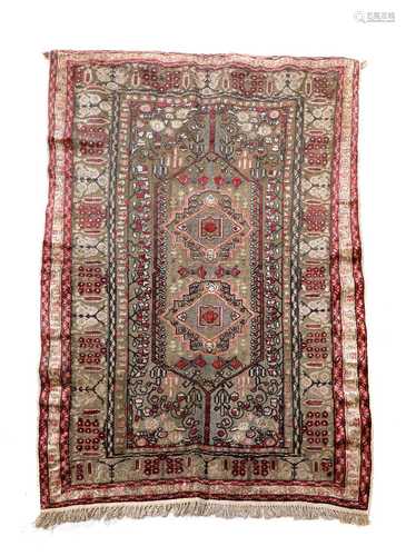 A Turkish silk and gold-coloured metal rug