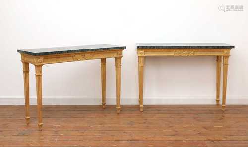 A pair of giltwood console tables in the manner of Robert Ad...