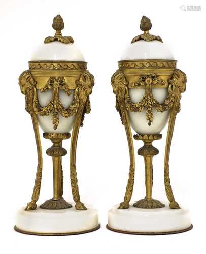 A pair of French Empire-style white marble and ormolu cassol...