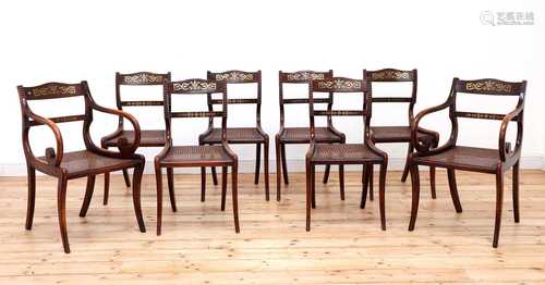 A set of eight simulated rosewood dining chairs,