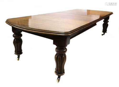 A Victorian walnut extending dining table