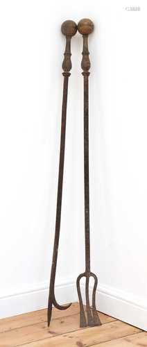 An oversize brass and steel log hook,