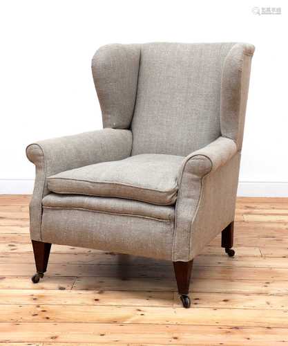 A wingback armchair,