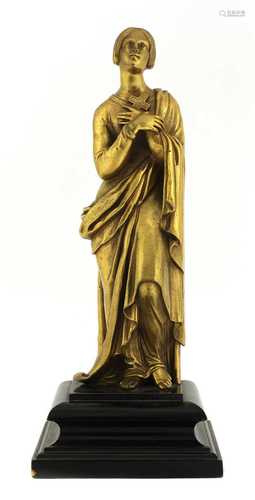 A gilt-metal figure of a girl,