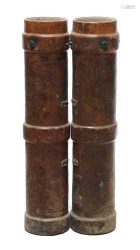 A pair of leather cordite cases,