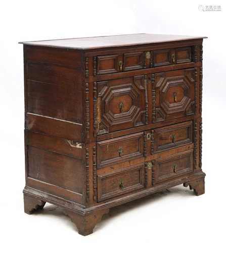 An oak transitional chest,