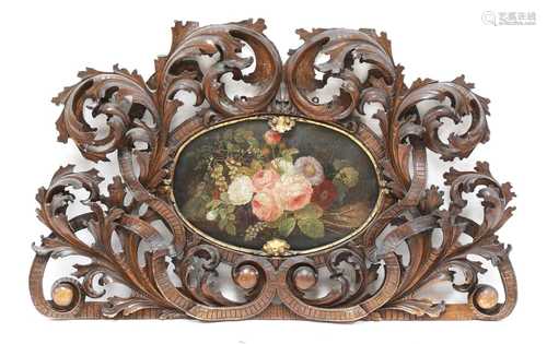 An ornately pierced and carved headboard,