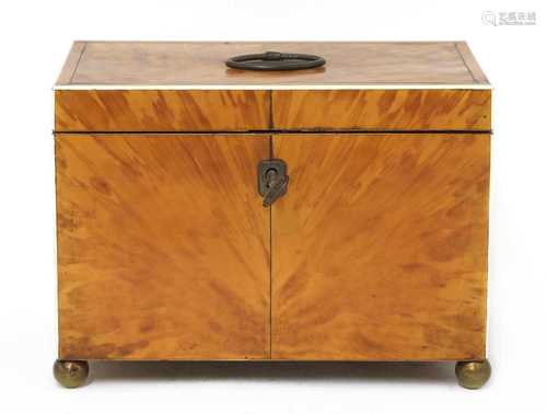 A blond tortoiseshell twin compartment tea caddy,