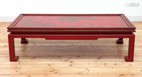 A Chinese-style red-lacquered coffee table in the manner of ...