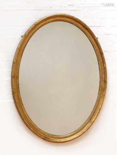 A George III-style oval wall mirror,