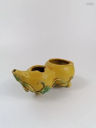 A yellow glazed waterpot