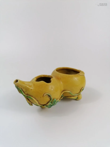 A yellow glazed waterpot