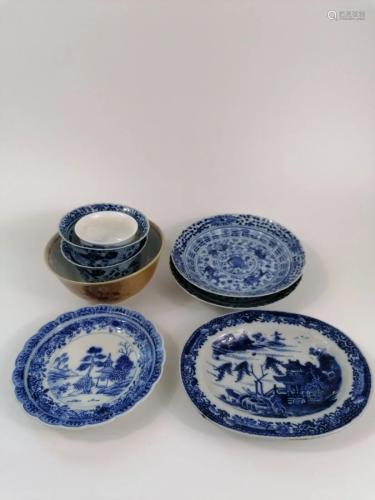 A Group of blue and white porcelain tea cups and sauce