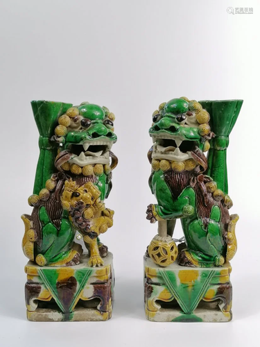 PAIR OF SANCAI-GLAZED JOSS STICK HOLDERS