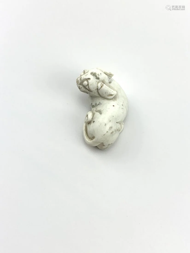 A Chicken bone white jade dog