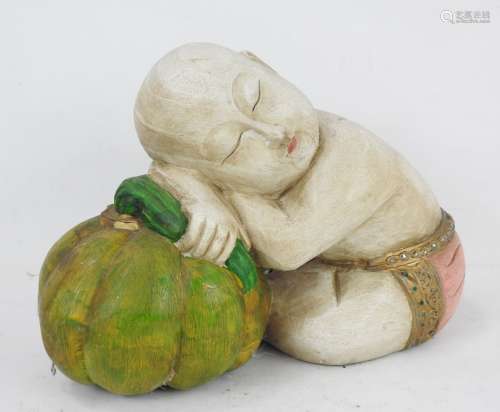 CHINE : Enfant couché sur un melon. Sujet en bois sculpté et...