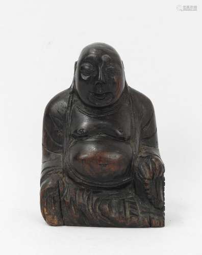 BOUDDHA en bois sculpté. Haut.: 10 cm.