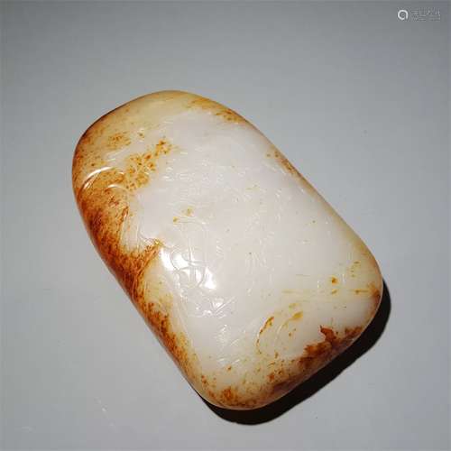 A QING DYNASTY CARVED HETIAN SEED JADE YELLOW JAMBHALA FIGUR...