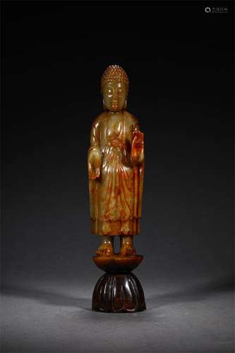 A HAN DYNASTY HETIAN JADE SAKYA STATUE