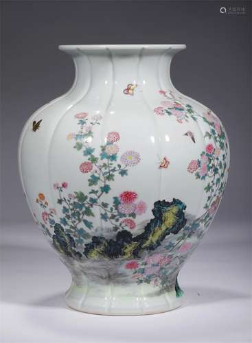 A QING DYNASTY FAMILLE ROSE FLOWER AND BUTTERFLY GRAIN MELON...