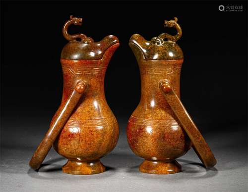 A PAIR OF WARRING HETIAN JADE HANDLE POTS