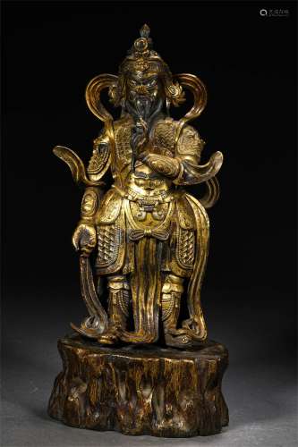 A MING DYNASTY GILT BRONZE KING STATUE