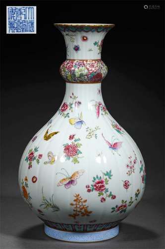 A QING DYNASTY FAMILLE ROSE FLOWER AND BUTTERFLY GRAIN MELON...