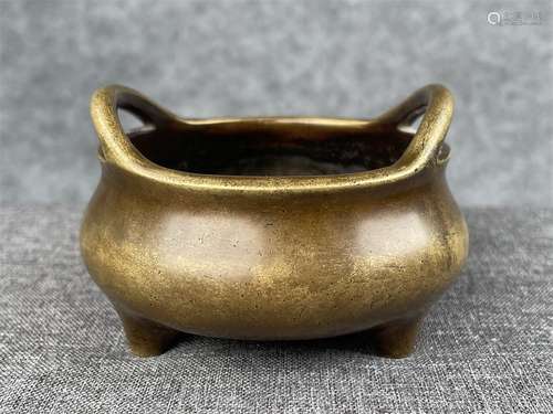 A MING DYNSATY XUANDE BRIDGE EARS TRI-FOOT BRONZE INCENSE BU...