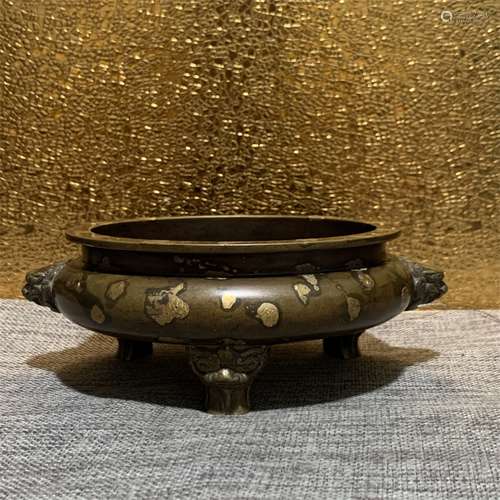 A QING DYNASTY SPRINKLED GOLD TRI-FOOT BEAST EARS BRONZE INC...