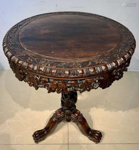 RED WOOD CARVED ROUND TABLE