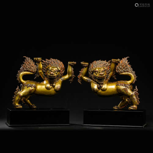 A PAIR OF GILT BRONZE LIONS, MING DYNASTY, CHINA