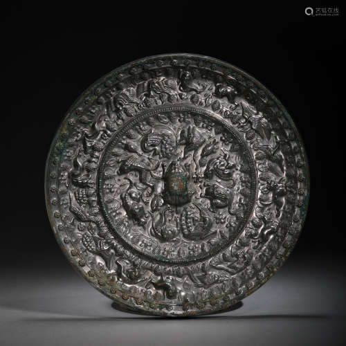 TANG DYNASTY, CHINESE BRONZE MIRROR CARVED WITH SEA BEAST AN...