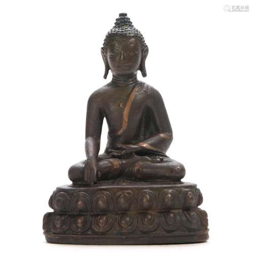 A COPPER-INLAID COPPER ALLOY FIGURE OF SHAKYAMUNI