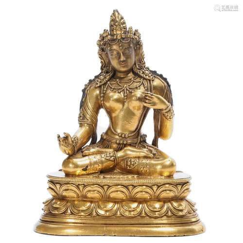 A GILT-BRONZE FIGURE OF SEATED TARA