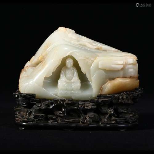 A WHITE JADE SHAKYAMUNI CARVING