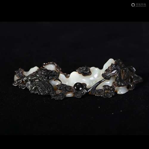 A BLACK AND WHITE JADE 'DRAGON' BRUSH REST