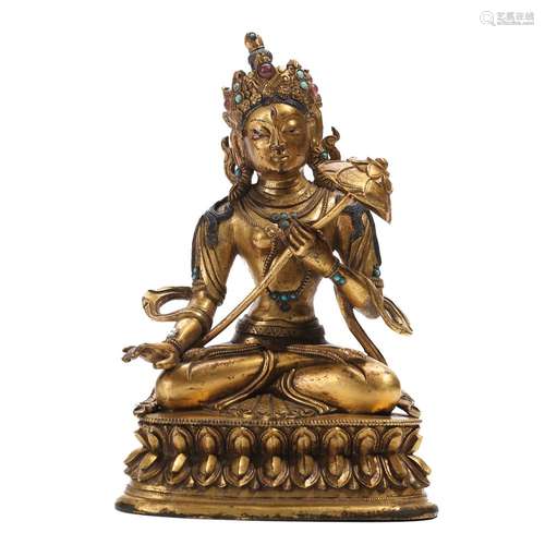 A GILT-BRONZE FIGURE OF SEATED TARA