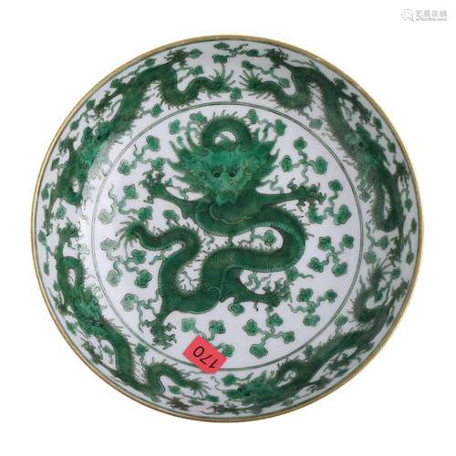 A GREEN AND WHITE DRAGON DISH