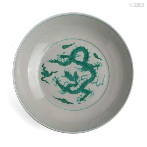 A GREEN AND WHITE DRAGON DISH